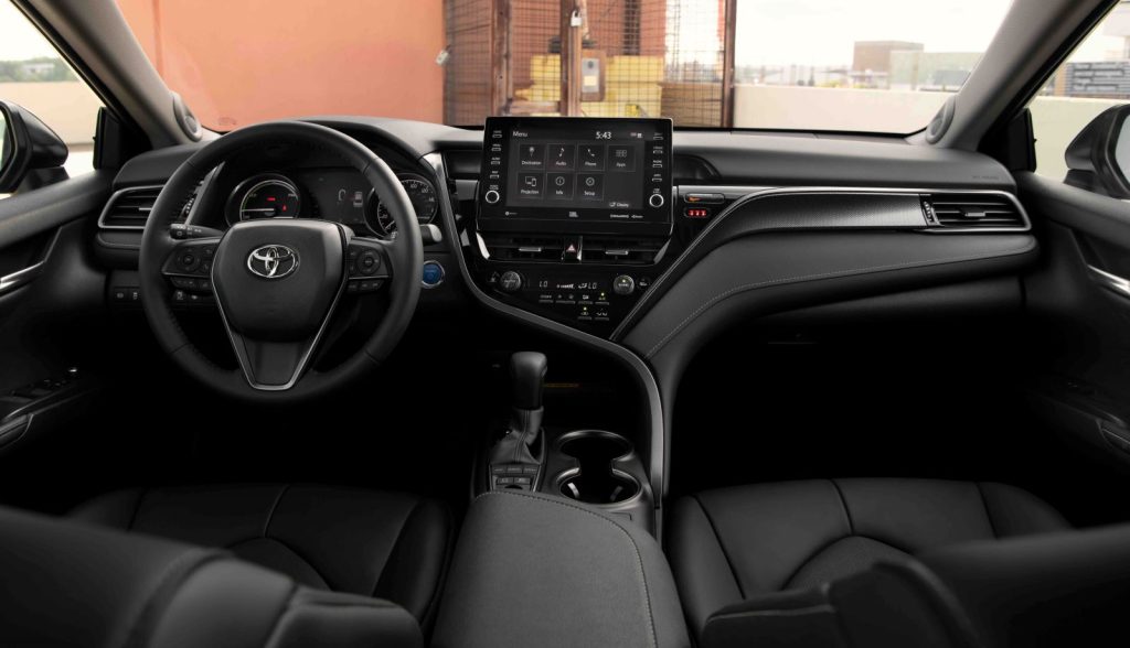 All-black interior of the 2022 Toyota Camry Hybrid, which has a less-premium cabin than the 2022 Hyundai Sonata Hybrid