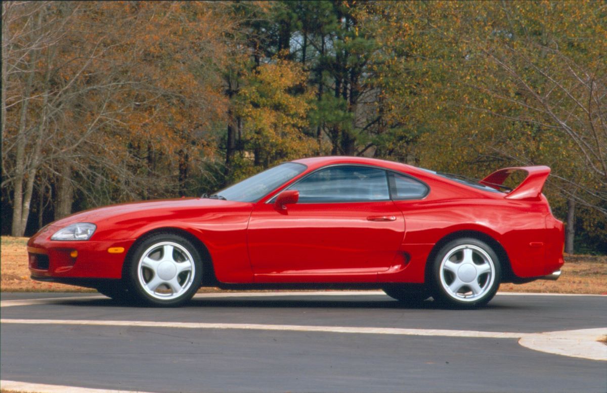 A red classic Toyota Supra sports car from the fourth generation