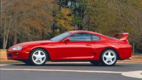 A red classic Toyota Supra sports car from the fourth generation
