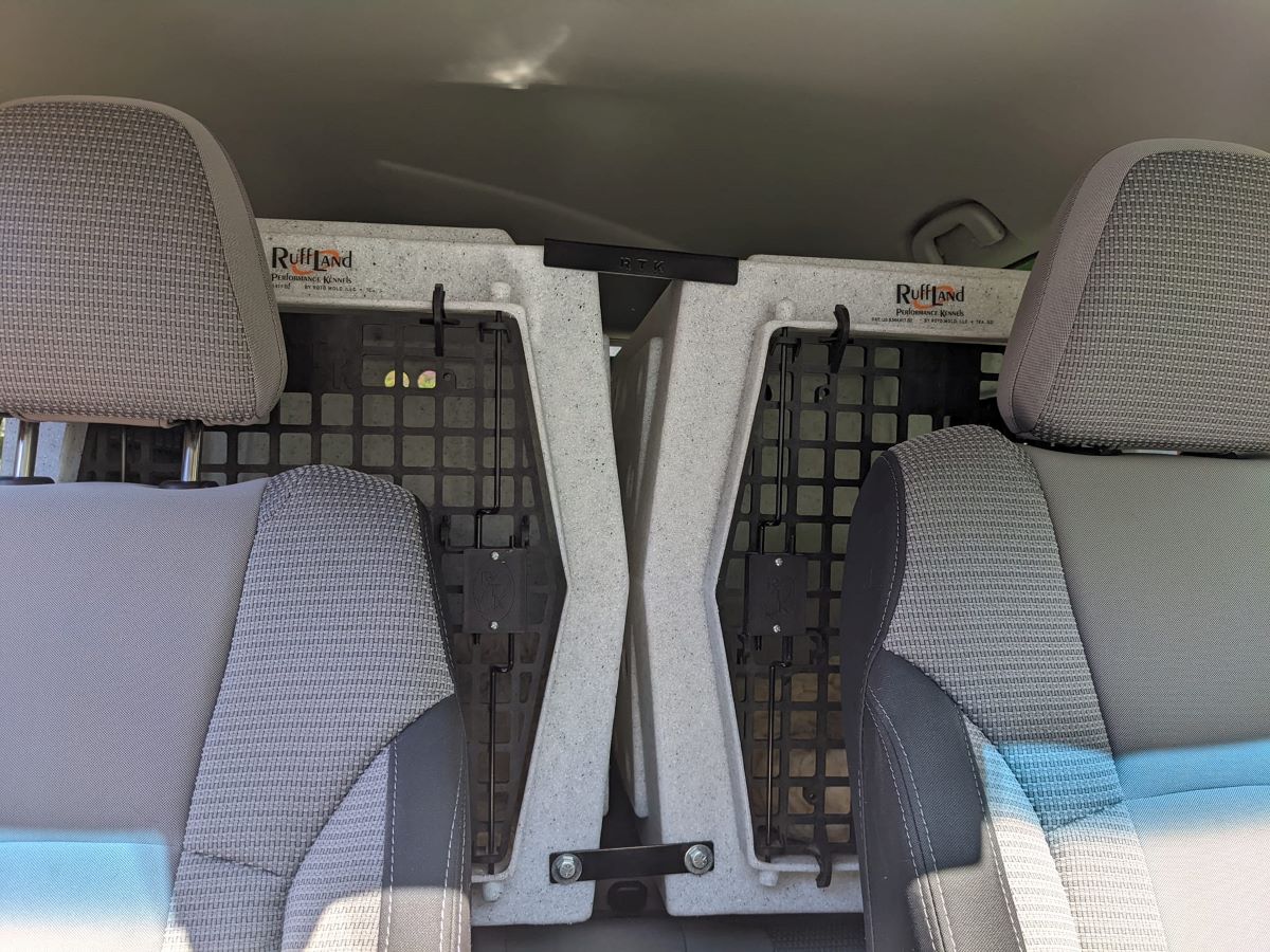 A set of two Intermediate Ruffland crates attached by a coupler bar and secured behind the row of front seats