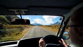 A man driving an RV motorhome to Aoraki Mount Cook in New Zealand