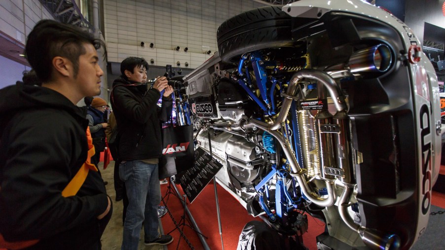 Visitors look at a aftermarket exhaust system.