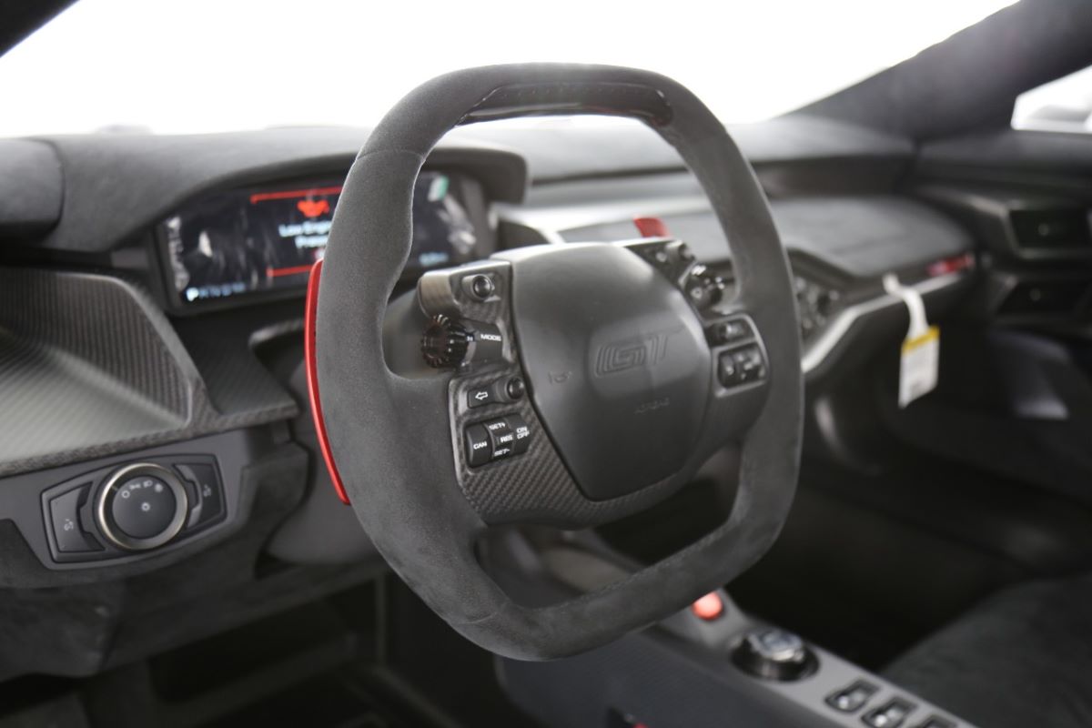 Close up of the stalkless steering wheel in a Ford GT interior. Black on black is just one of the Ford GT's interior color combinations