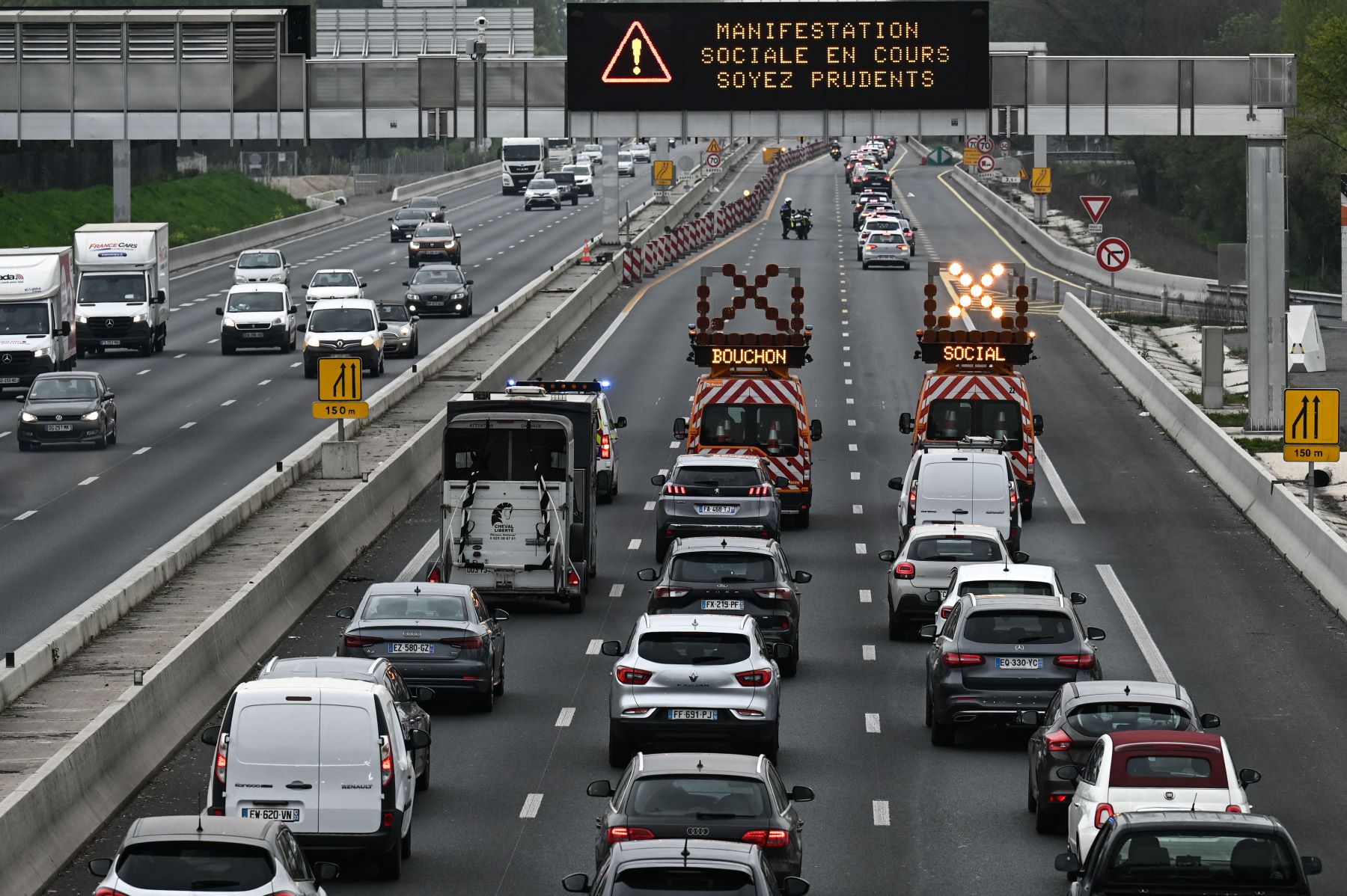 Highway safety trucks slowing down traffic in Bordeaux, France