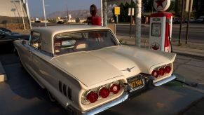 Premium fuel filling up a 1958 Thunderbird at a vintage gas station in Fillmore, California