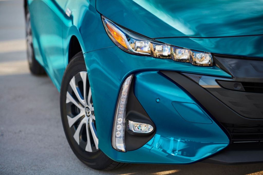Close up of the front corner of a teal 2022 Toyota Prius Prime, one of the best and cheapest plug-in hybrid electric vehicles