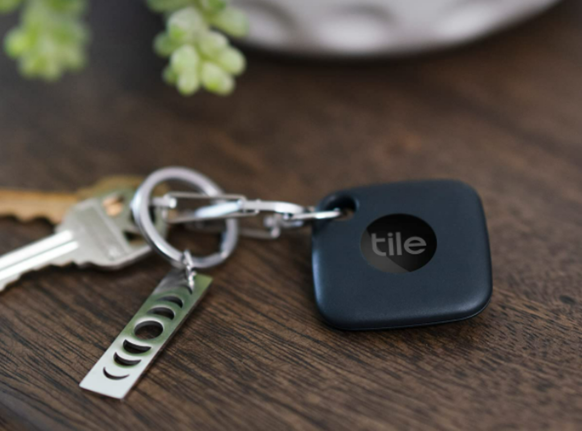 Black Tile Bluetooth tracking clicked on keychain.  A Tile Mate is one of the best interior accessories for cars.