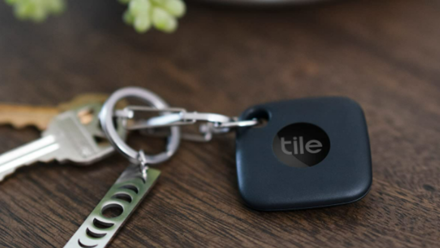 Black Tile bluetooth tracked clipped onto keychain. A Tile Mate is one of the best interior car accessories.
