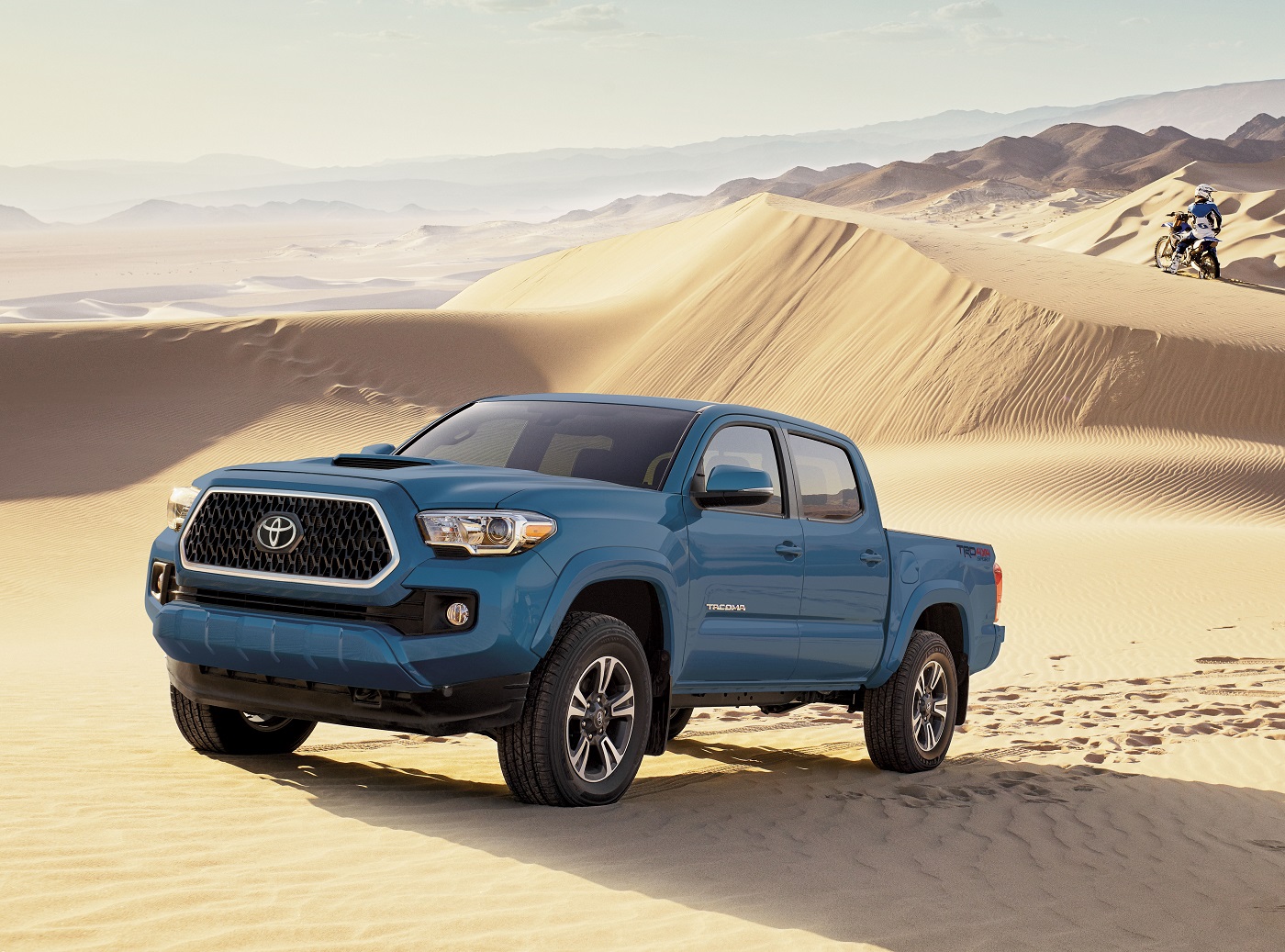 The 2023 Tacoma TRD Sport pictured in blue in the desert.