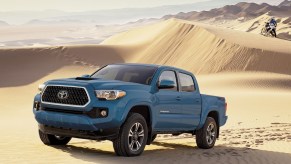 The 2023 Tacoma TRD Sport pictured in blue in the desert.