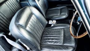 Black leather seats in an old classic car. Water stains on car seats can be frustrating, but they can be removed