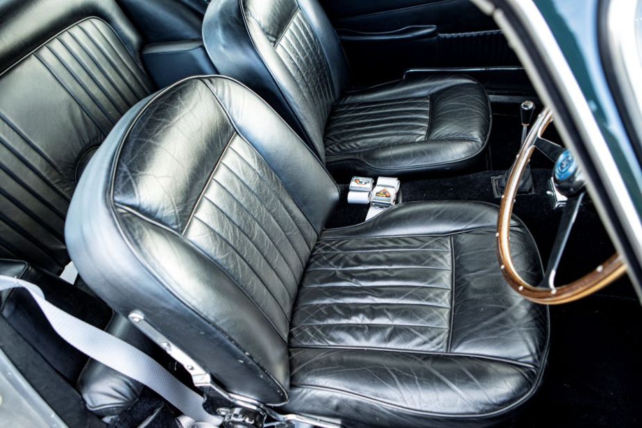Black leather seats in an old classic car. Water stains on car seats can be frustrating, but they can be removed