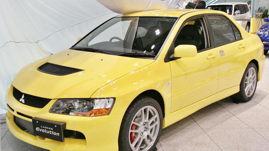 A yellow 2006 Mitsubishi Lancer Evolution IX.