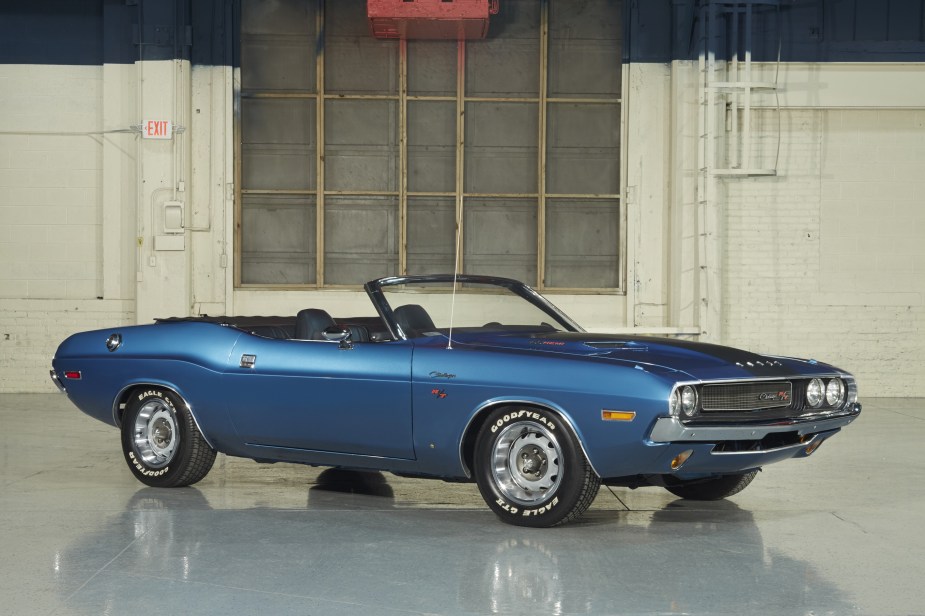 A blue 1970 Dodge Challenger R/T Convertible in a garage