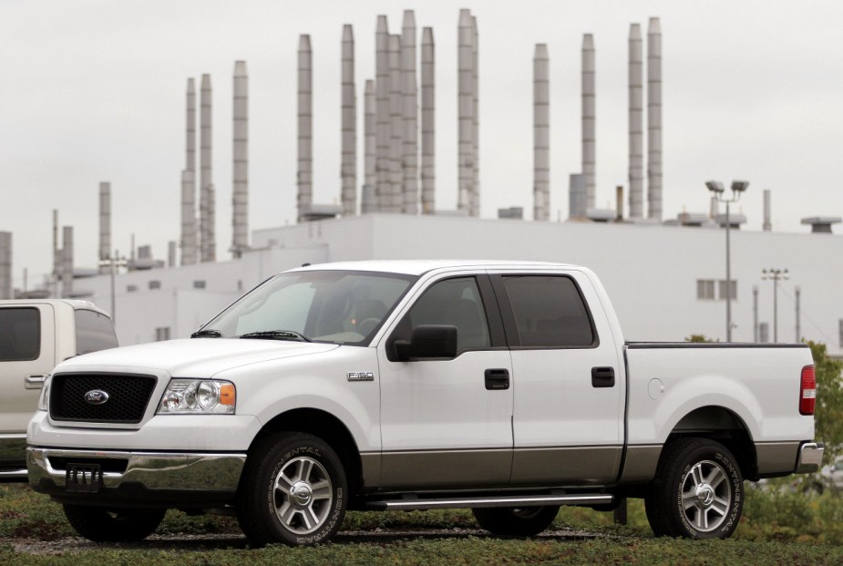 A white 11th generation Ford truck sits outside a factory in Michigan