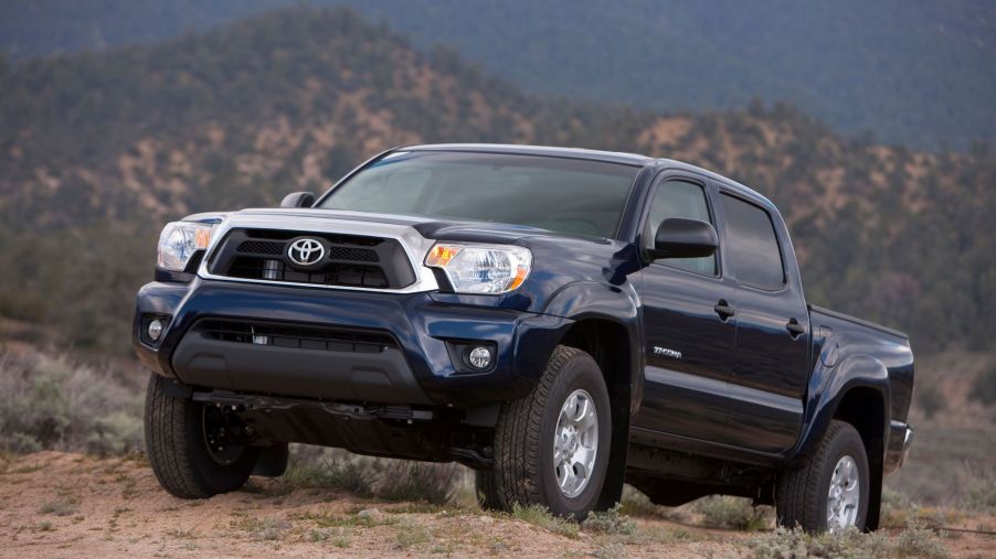 A Toyota Tundra on top of a dusty hill. Models from 2012-15 are among the worst Toyota Tundra models.