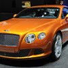 An orange 2012 Bentley Continental GT at the 2011 Geneva Motor Show