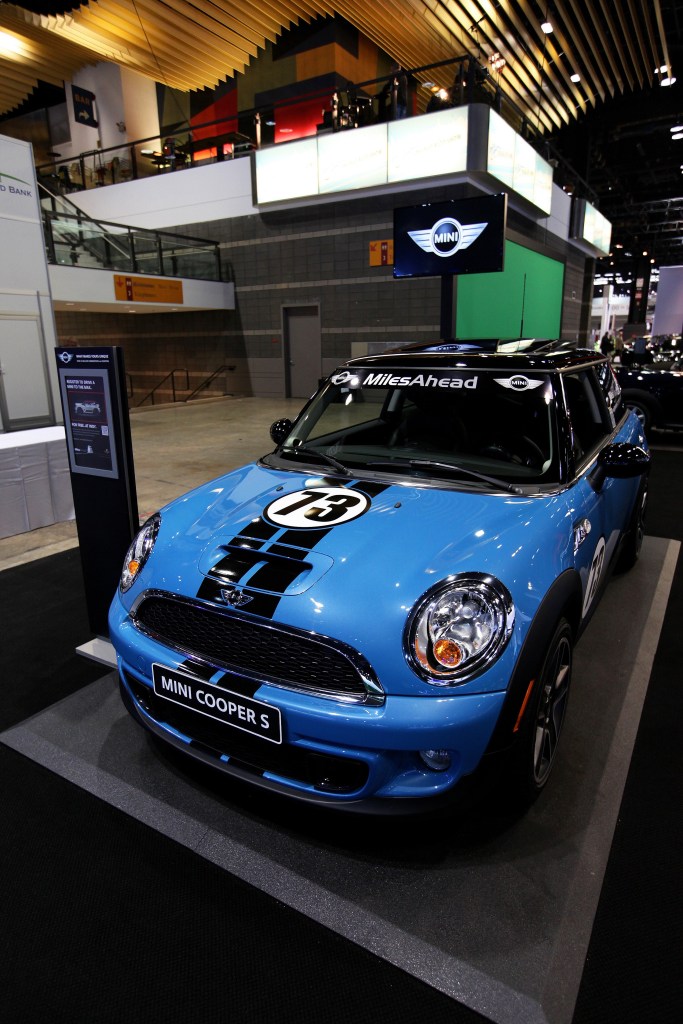 A blue-with-black-stripes 2013 R56 Mini Cooper S at the 2012 Chicago Auto Show