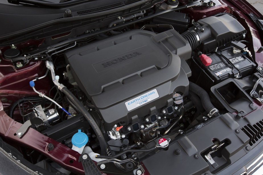 The engine bay of a maroon 2014 9th-gen Honda Accord EX-L V6 Sedan