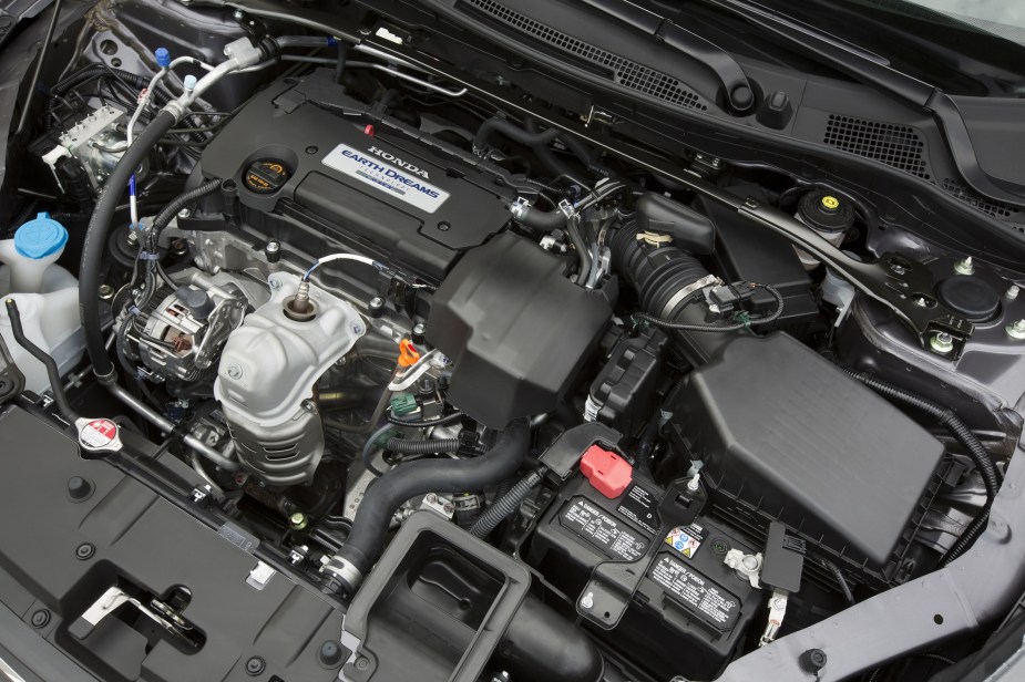 The 2.4-liter four-cylinder engine in the engine bay of a 2014 9th-gen Honda Accord Sport Sedan