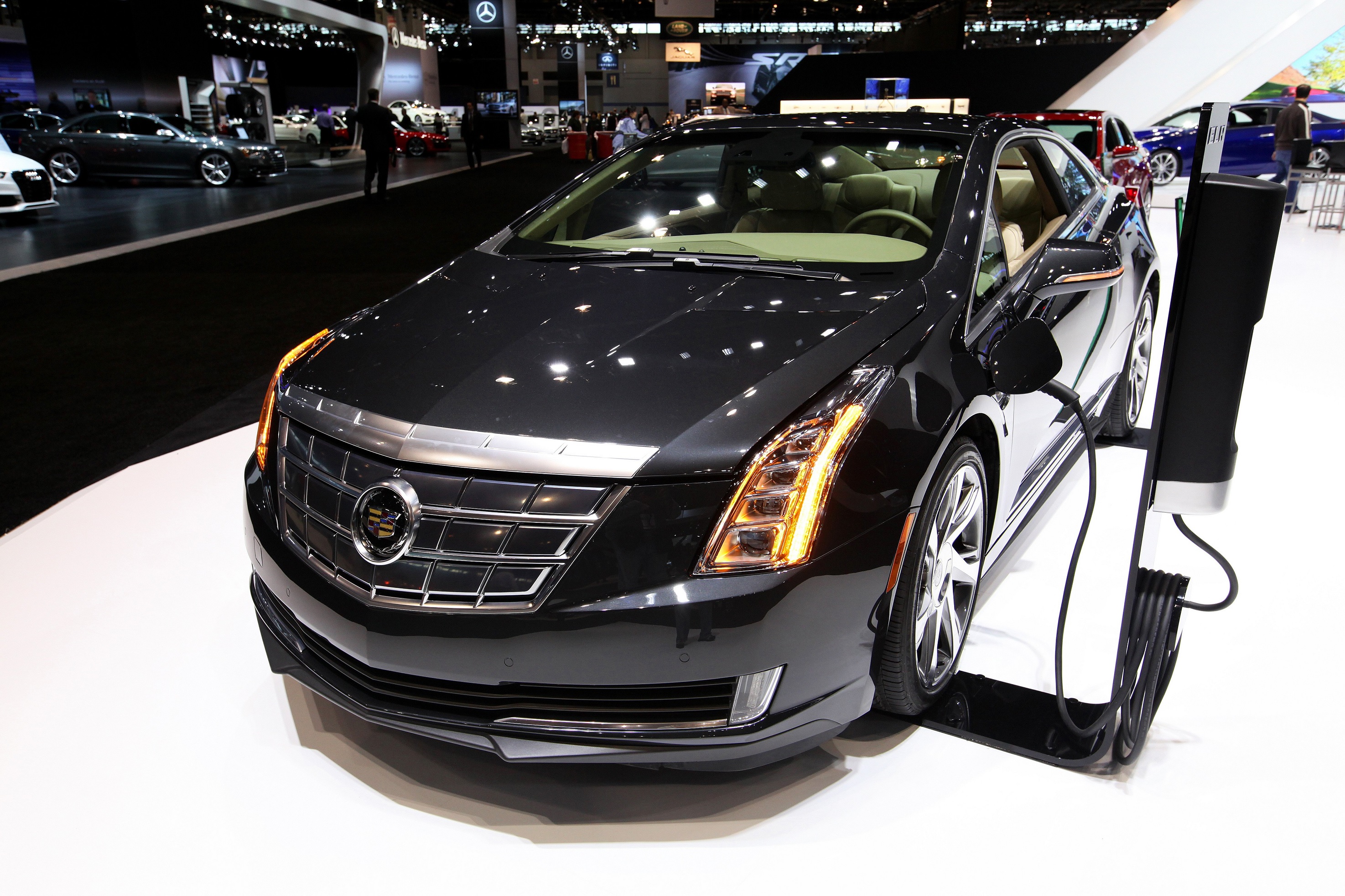 A black 2014 Cadillac ELR charging at the 2014 Chicago Auto Show