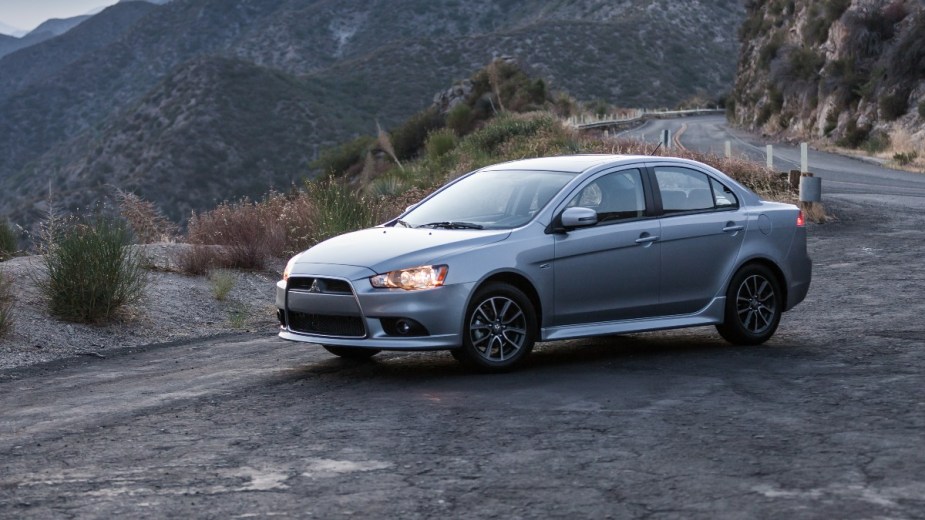 a silver 2015 mitsubishi lancer parked overlooking a cliff