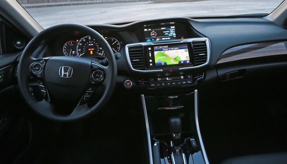 The steering wheel, dashboard, and center touchscreen of a 2016 9th-gen Honda Accord EX-L V6