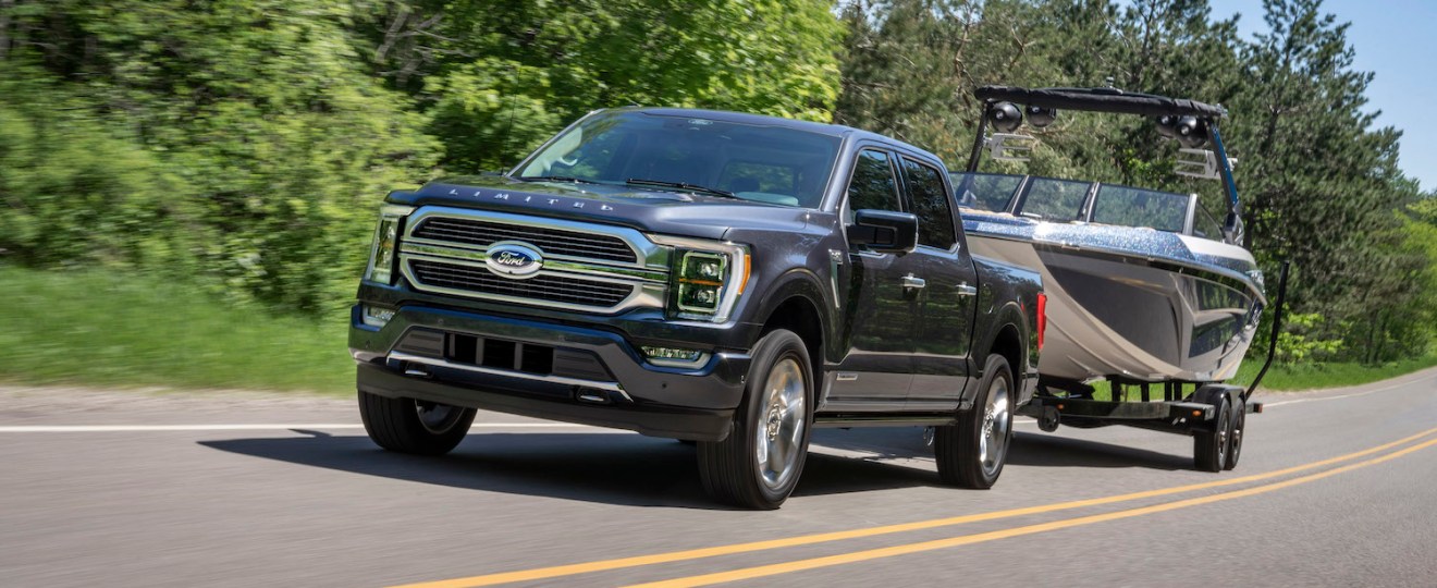 The 2022 Ford F-150 PowerBoost Hybrid towing a boat
