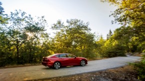 2022 TLX Advance in red driving on the street