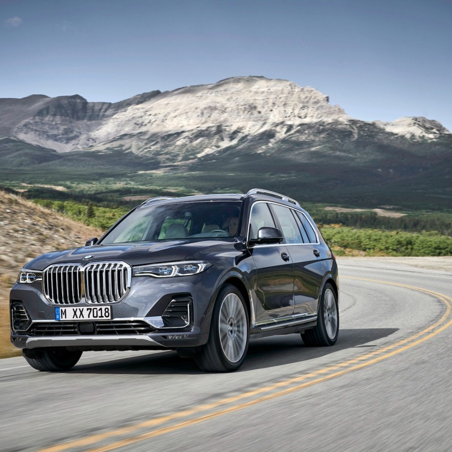 A gorgeous 2022 BMW X7 driving on a country road.