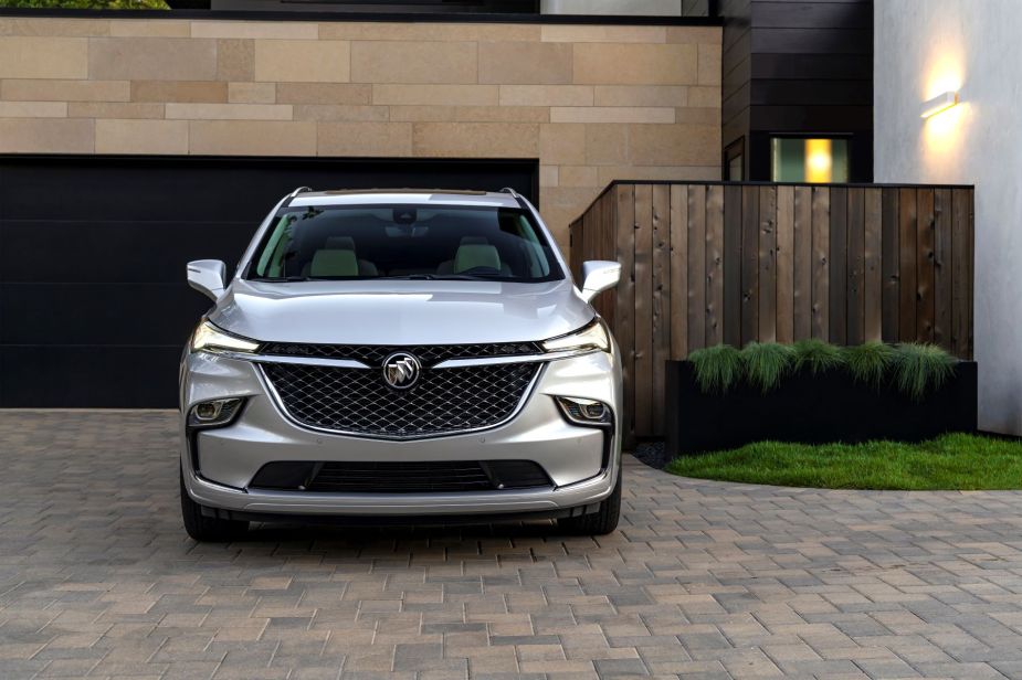 A 2022 Buick Enclave midsize crossover SUV model parked on a cobblestone driveway