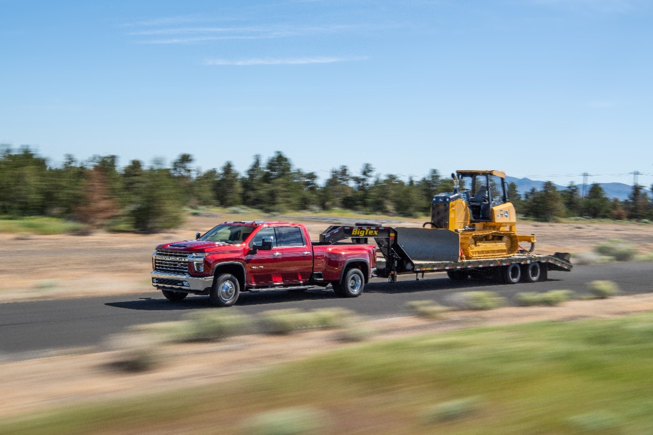 2021 Diesel Chevy truck towing a tractor