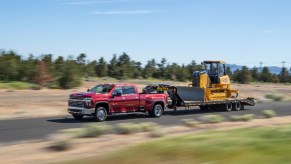 2021 Diesel Chevy truck towing a tractor