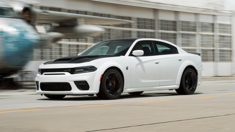 a 2022 white dodge charger hellcat, a performance sedan with an incredible resale value