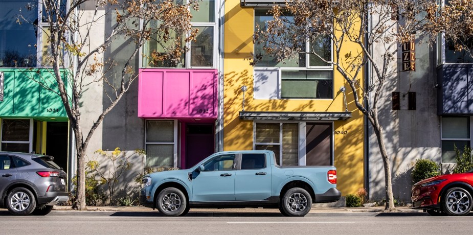 a 2022 Ford Maverick in blue in the street. Only this pickup starts under $25,000. 
