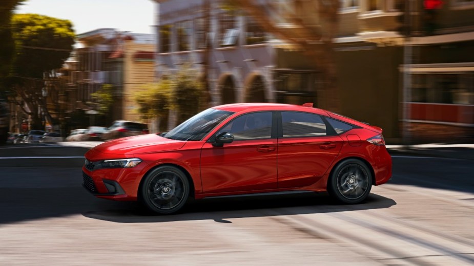 a red 2022 honda civic hatchback, one of the best new hatchbacks for 2022 with its performance and cargo space