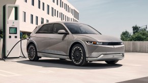 A gray 2022 Hyundai Ioniq 5 electric SUV is charging.