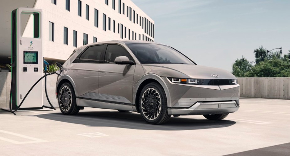 A gray 2022 Hyundai Ioniq 5 electric SUV is charging. 