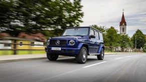 A 2022 Mercedes-Benz G-Class is driving on the road.