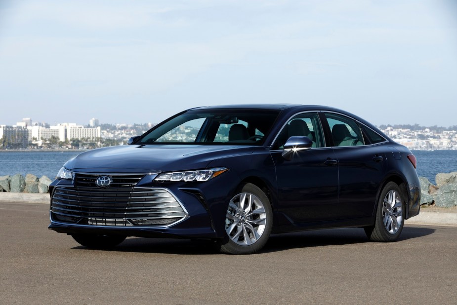 The longest-lasting vehicles on the road, like this Toyota Avalon in dark livery, will last over 200,000 miles.