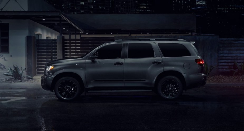 A gray 2022 Toyota Sequoia full-size SUV is parked in the street. 