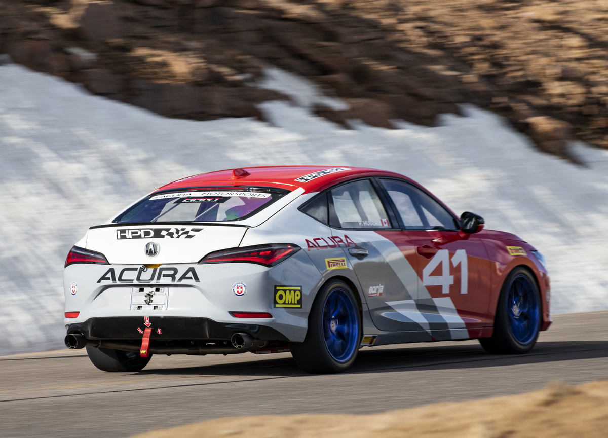 2023 Acura Integra Pikes Peak  testing on the hill climb course passing Snow in the Background
