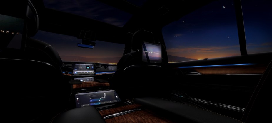 The interior of the Grand Wagoneer SUV at night.