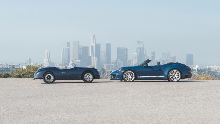the 2023 porsche 911 carrera gts cabriolet america parked across from a 1953 356 american roadster, the model that is influencing the newest convertible
