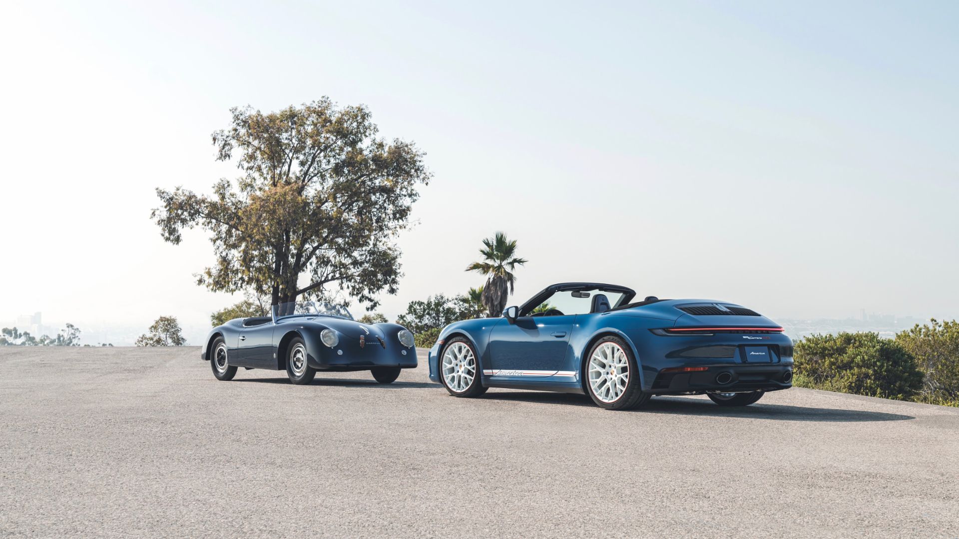 2023 Porsche 911 Cabriolet America Edition and 1953 Porshe 356 America Roadster Parked face to face