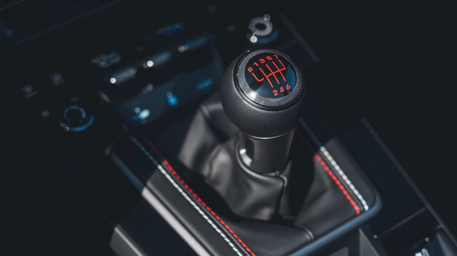 Pictured is the 2023 Porsche 911 Carrera GTS Cabriolet America edition's manual transmission