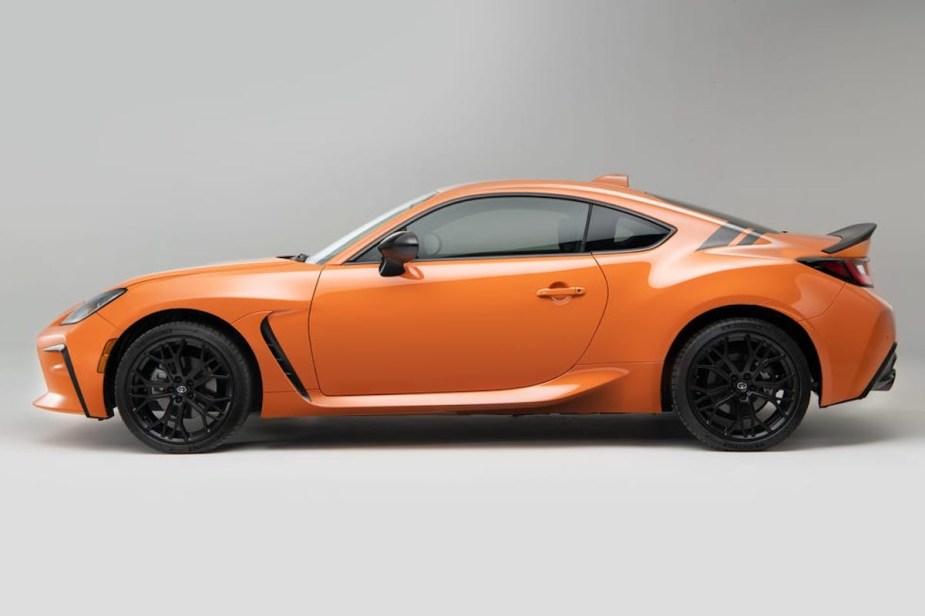 2023 Toyota GR86 Special Edition in orange against a white background.