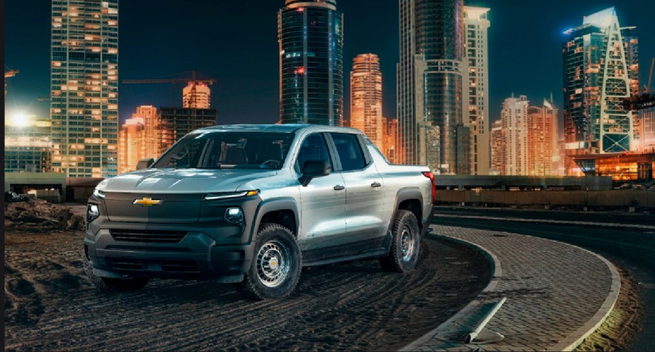 A silver 2024 Chevy Silverado EV Work Truck is parked. 