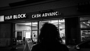 A car owner walking to a loan agency to get her repossessed car back