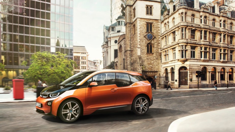an orange BMW i3 2021, a small electric car that stands out for its luxury